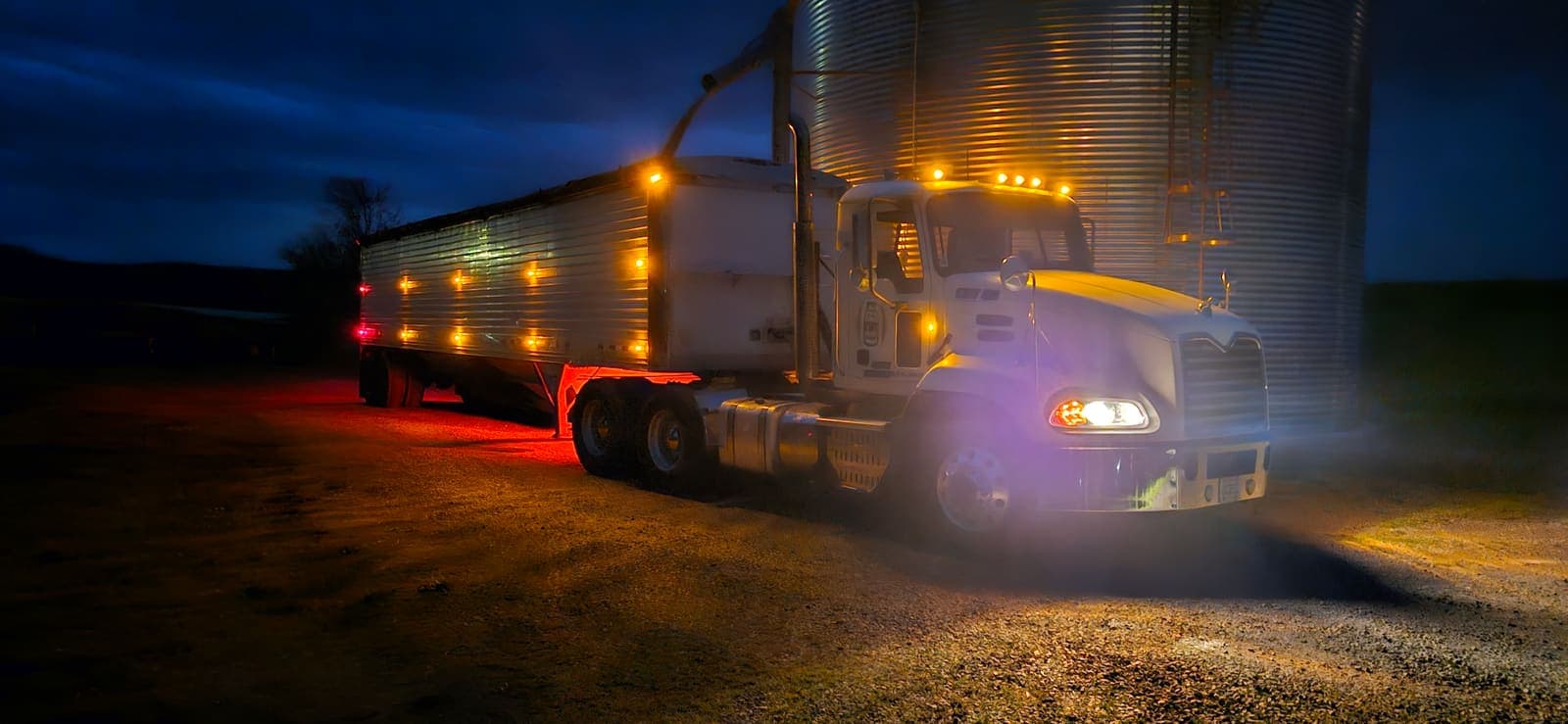 Loading grain at the bin, ready to roll.